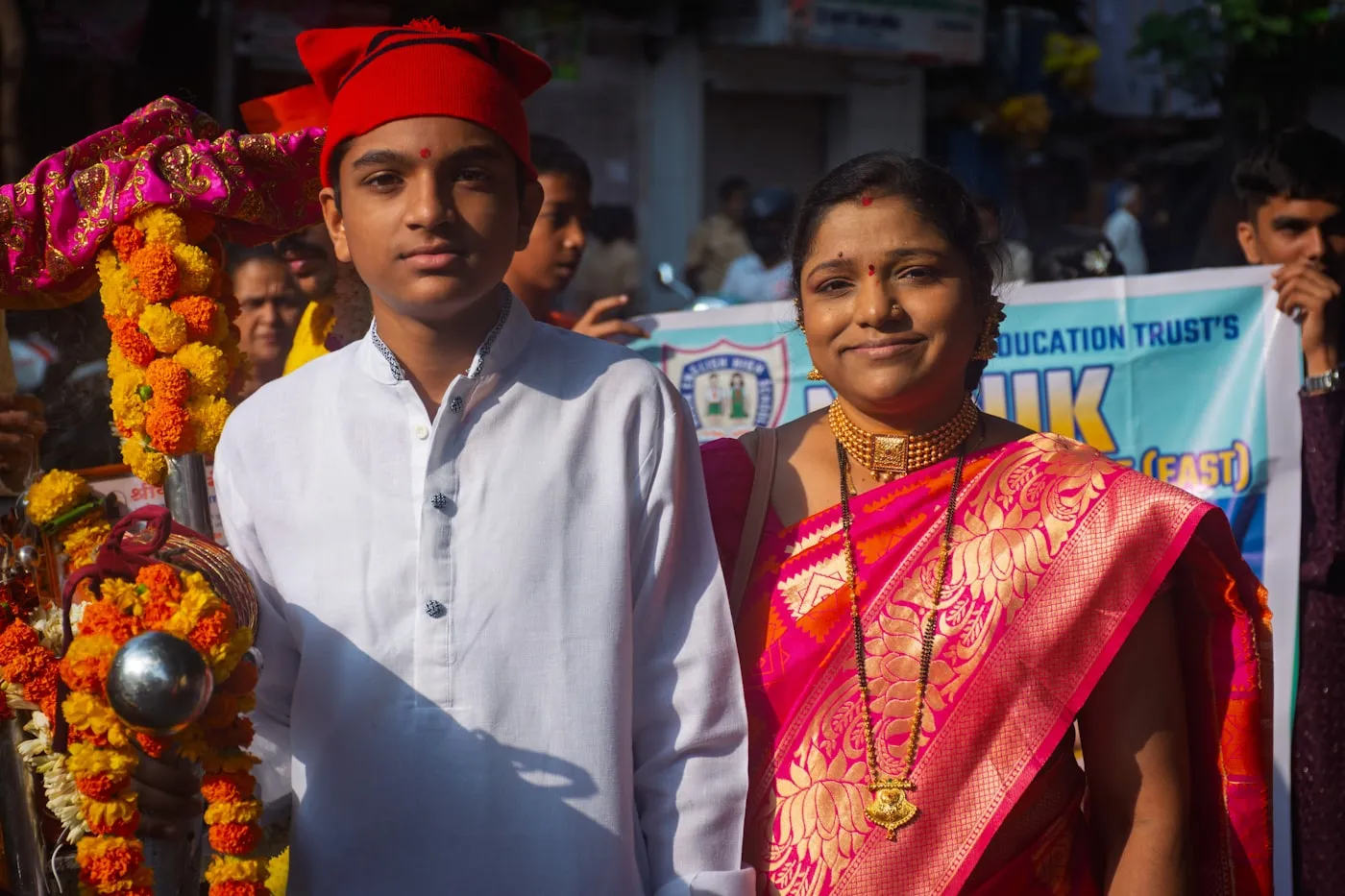 Young graduates in convocation attire on a university campus in India